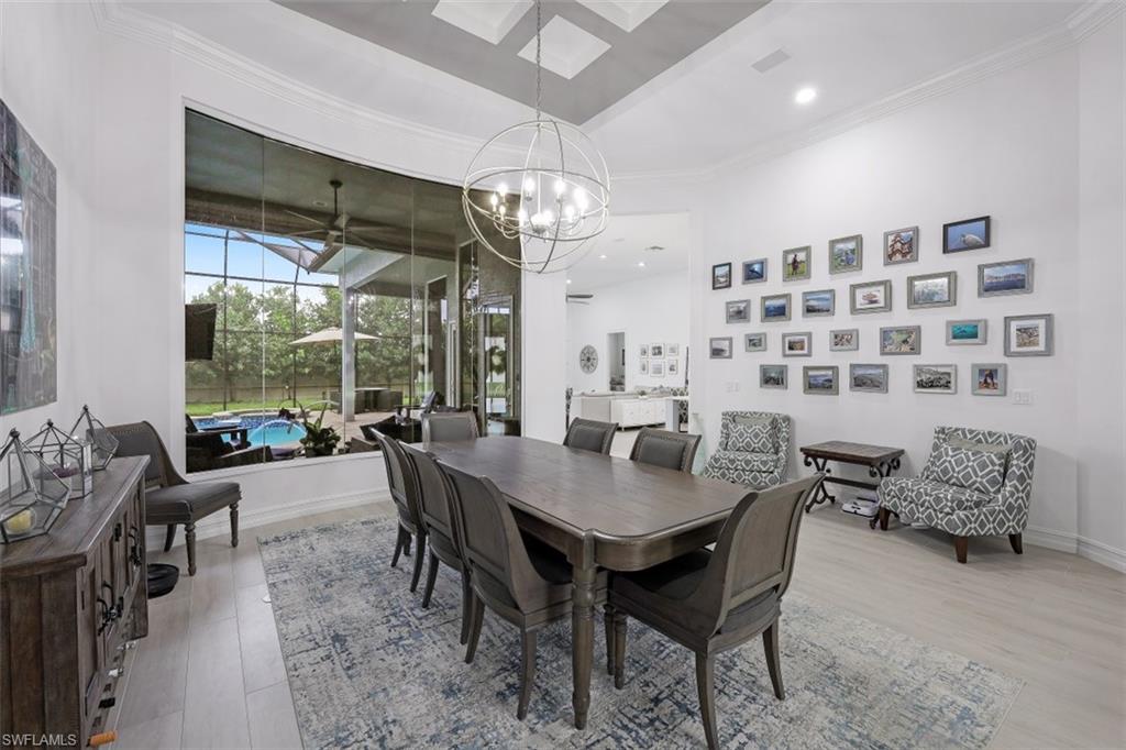 7235 Mill Run Road Naples, FL 34109 - Photo 16 of 31 a view of a dining room with furniture window and outside view