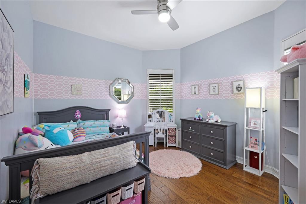 7235 Mill Run Road Naples, FL 34109 - Photo 22 of 31 a living room with furniture and a table