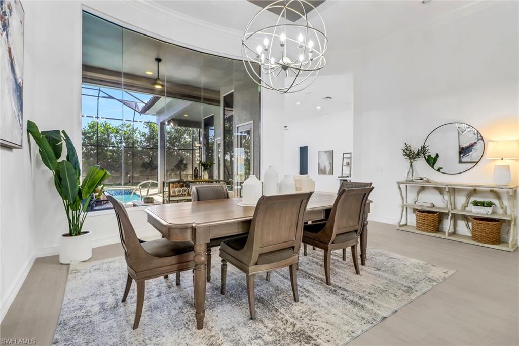 7235 Mill Run Road Naples, FL 34109 - Photo 8 of 31 a view of a dining room with furniture window and outside view