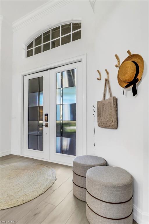 7235 Mill Run Road Naples, FL 34109 - Photo 9 of 31 a bedroom with a bed and window