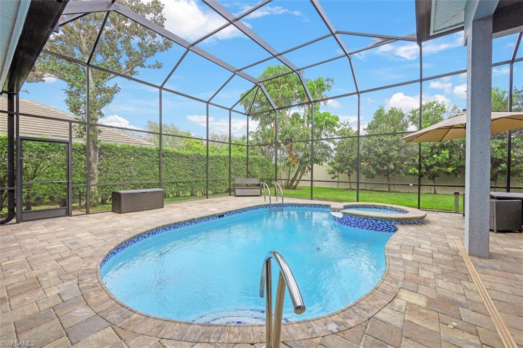 7235 Mill Run Road Naples, FL 34109 - Photo 10 of 31 a view of swimming pool with seating space