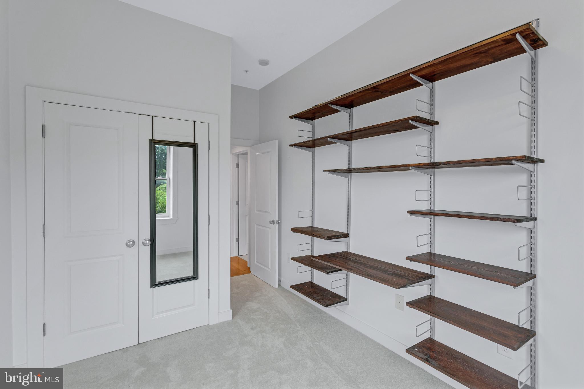 1240 4th Street Northwest, Unit 300 Washington, DC 20001 - Photo 27 of 31 Sleek, modern space with open shelving.