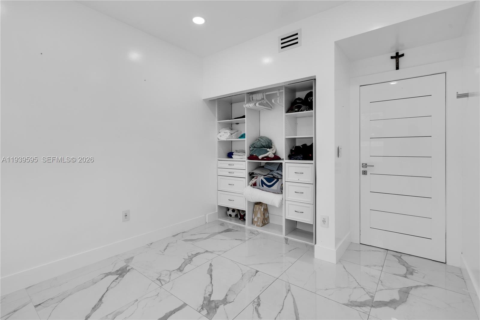 18801 Southwest 25th Court Miramar, FL 33029 - Photo 14 of 28 a view of a bedroom with a furniture and closet