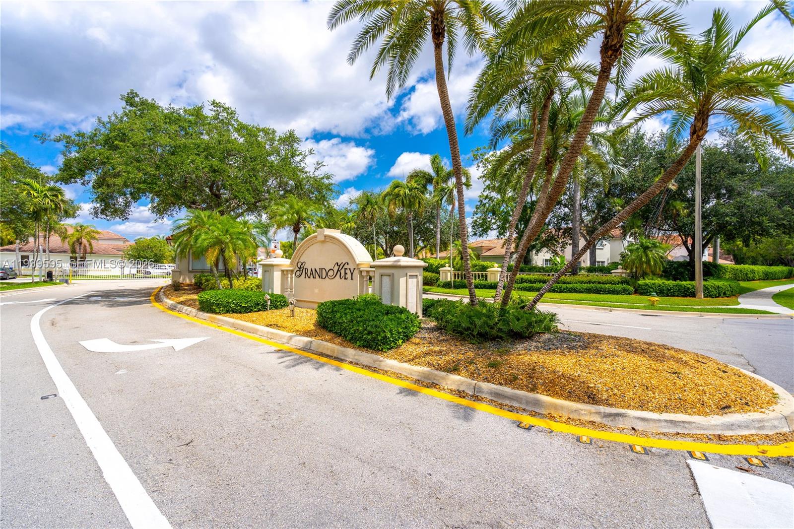 18801 Southwest 25th Court Miramar, FL 33029 - Photo 2 of 28 a view of a swimming pool with a garden and palm trees