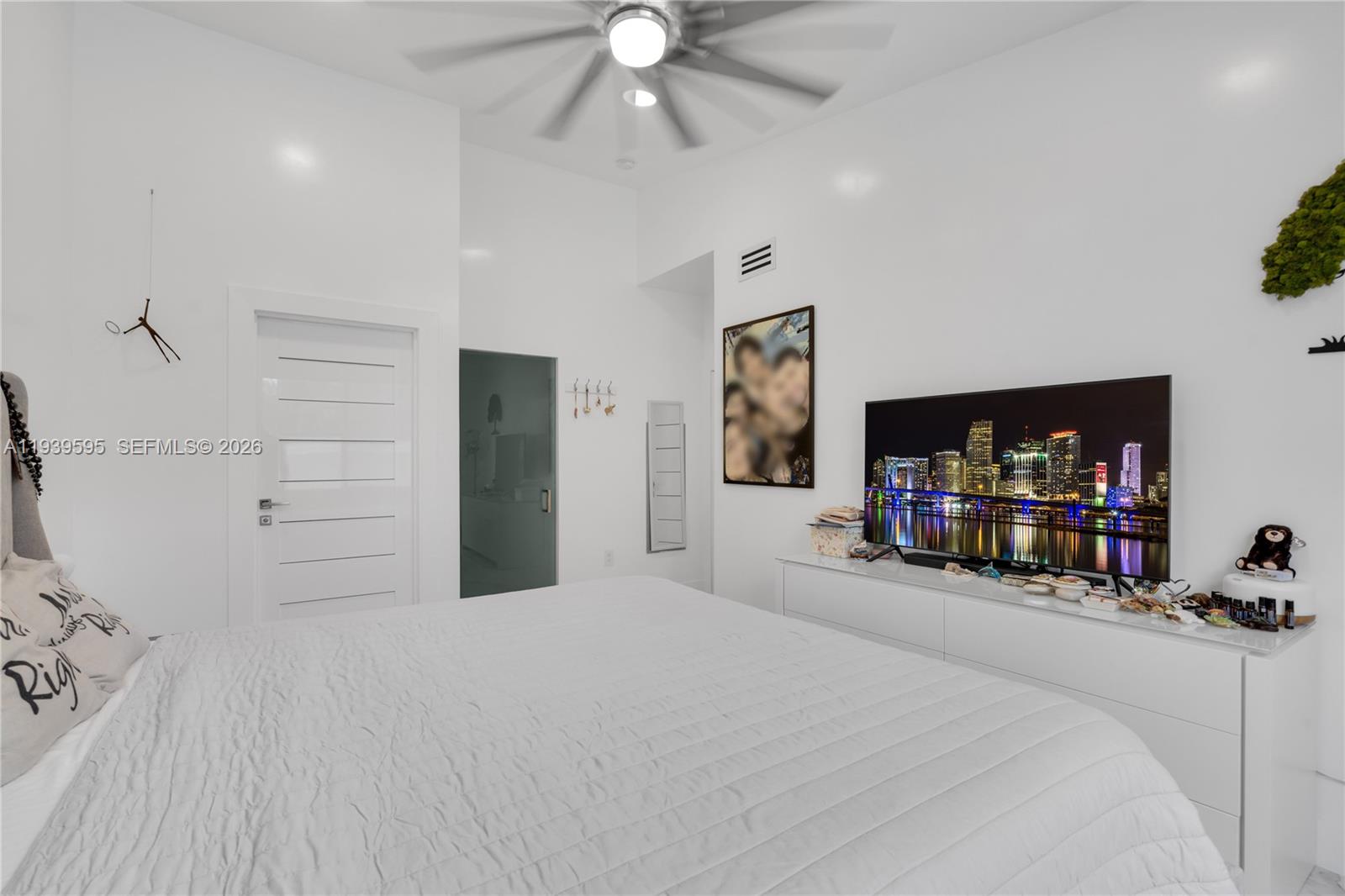 18801 Southwest 25th Court Miramar, FL 33029 - Photo 22 of 28 a bed room with a bed and a television