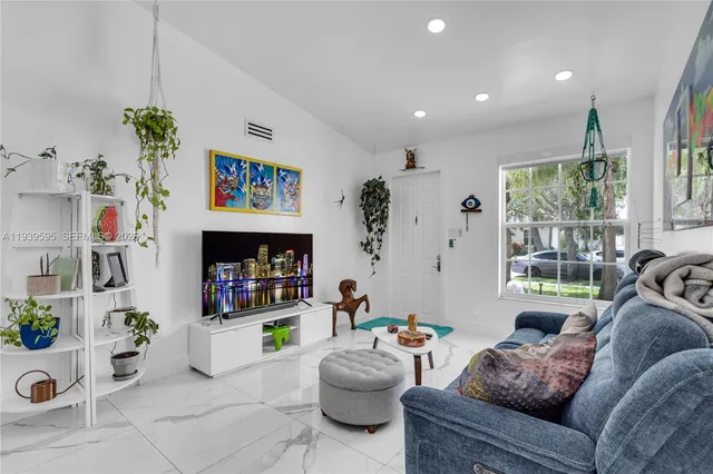 a living room with furniture and a couch