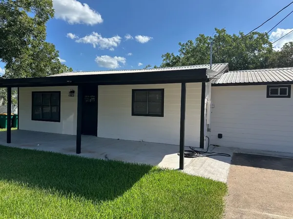a house view with a garden space