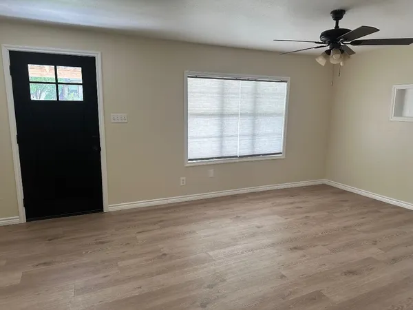 a view of an empty room with a window