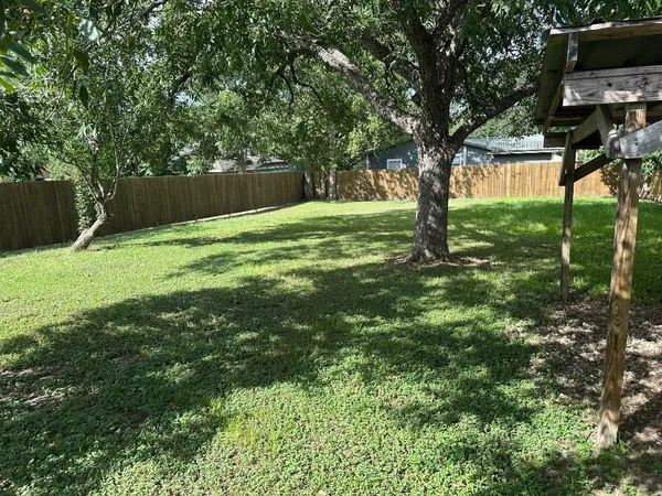 a view of backyard with green space