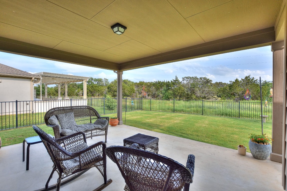 a patio with yard table and chairs