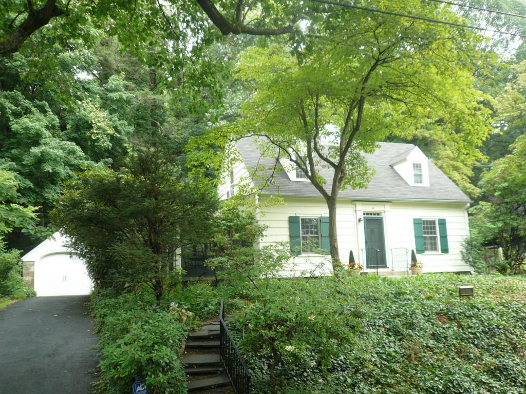 99 Mill Rock Road Hamden, CT 06517 - Photo 1 of 1 a front view of a house with a yard and potted plants