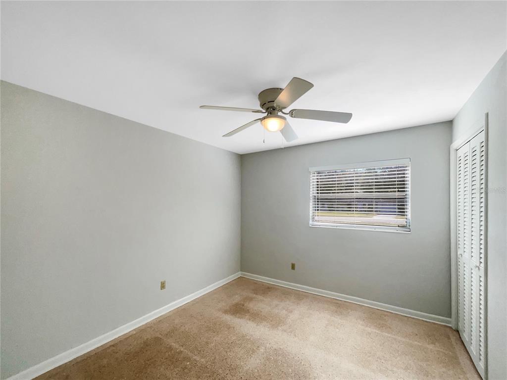 5250 Timberlane Road Lake Wales, FL 33898 - Photo 17 of 23 an empty room with a window and a fan