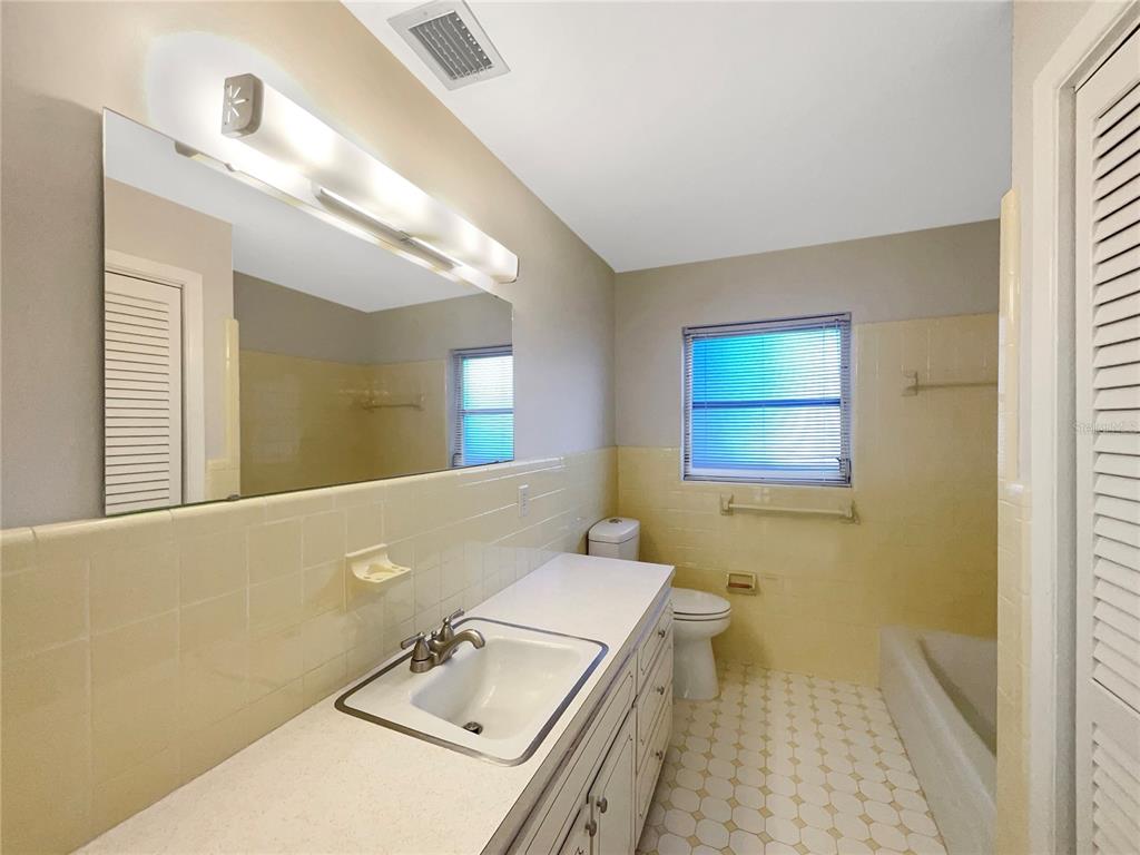 5250 Timberlane Road Lake Wales, FL 33898 - Photo 19 of 23 a bathroom with a sink a toilet and mirror