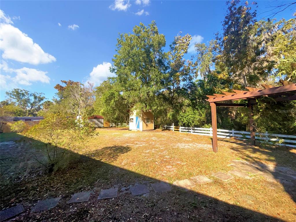 5250 Timberlane Road Lake Wales, FL 33898 - Photo 21 of 23 a view of a swimming pool with an outdoor space and seating area