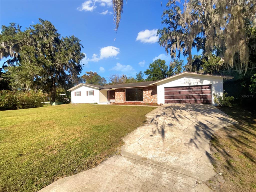 5250 Timberlane Road Lake Wales, FL 33898 - Photo 8 of 23 a front view of a house with garden
