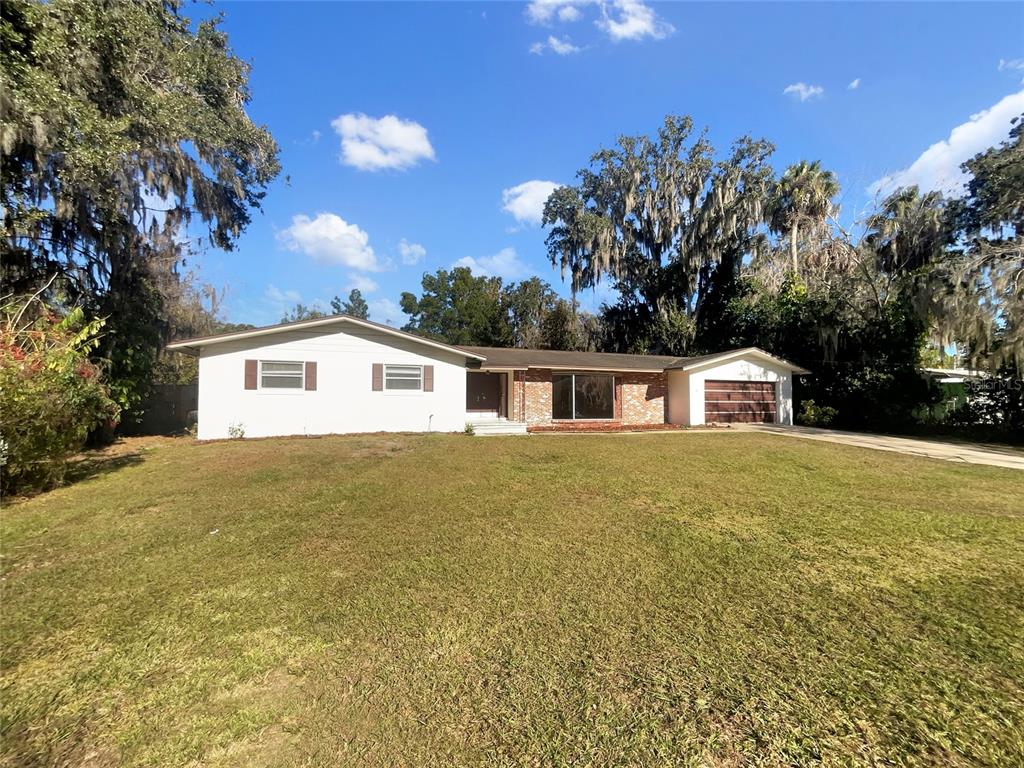 5250 Timberlane Road Lake Wales, FL 33898 - Photo 10 of 23 a front view of a house with a yard and trees