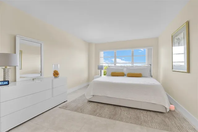 a bedroom with a bed and couch