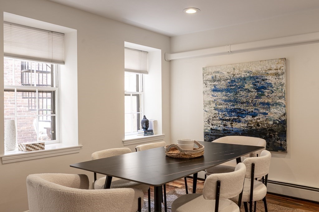 18 Melrose Street, Unit 1 Boston, MA 02116 - Photo 5 of 24 a view of a dining room with furniture and window