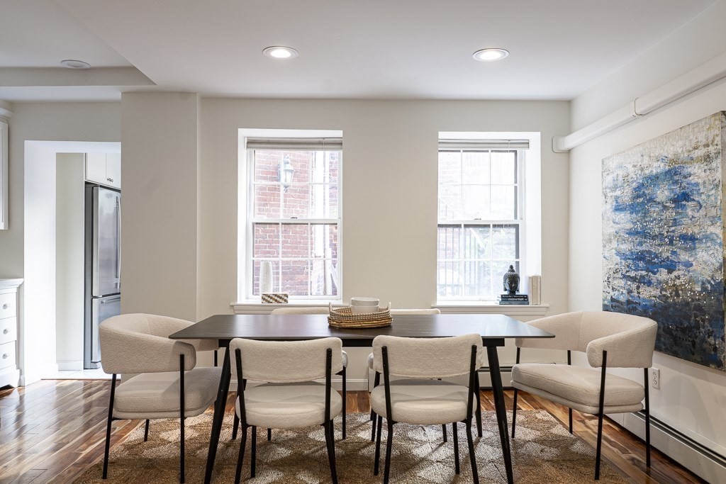 18 Melrose Street, Unit 1 Boston, MA 02116 - Photo 6 of 24 a dining room with furniture and window