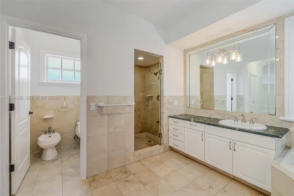 a view of an empty room and closet area