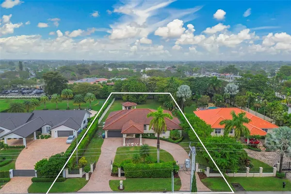 an aerial view of a house with a garden