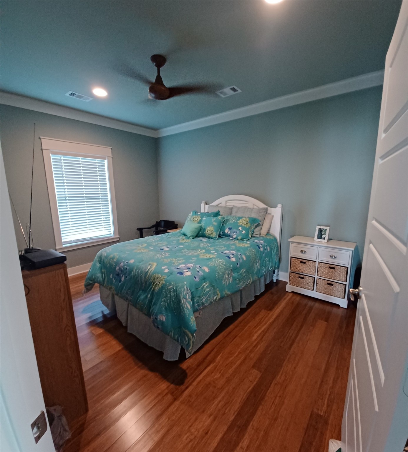 1279 Faggard Road Port Bolivar, TX 77650 - Photo 11 of 14 a bedroom with a bed and wooden floor