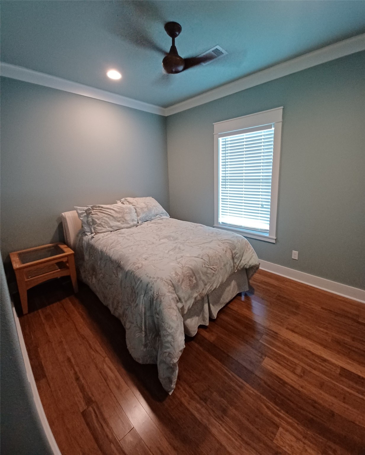 1279 Faggard Road Port Bolivar, TX 77650 - Photo 14 of 14 a bedroom with a bed and wooden floor
