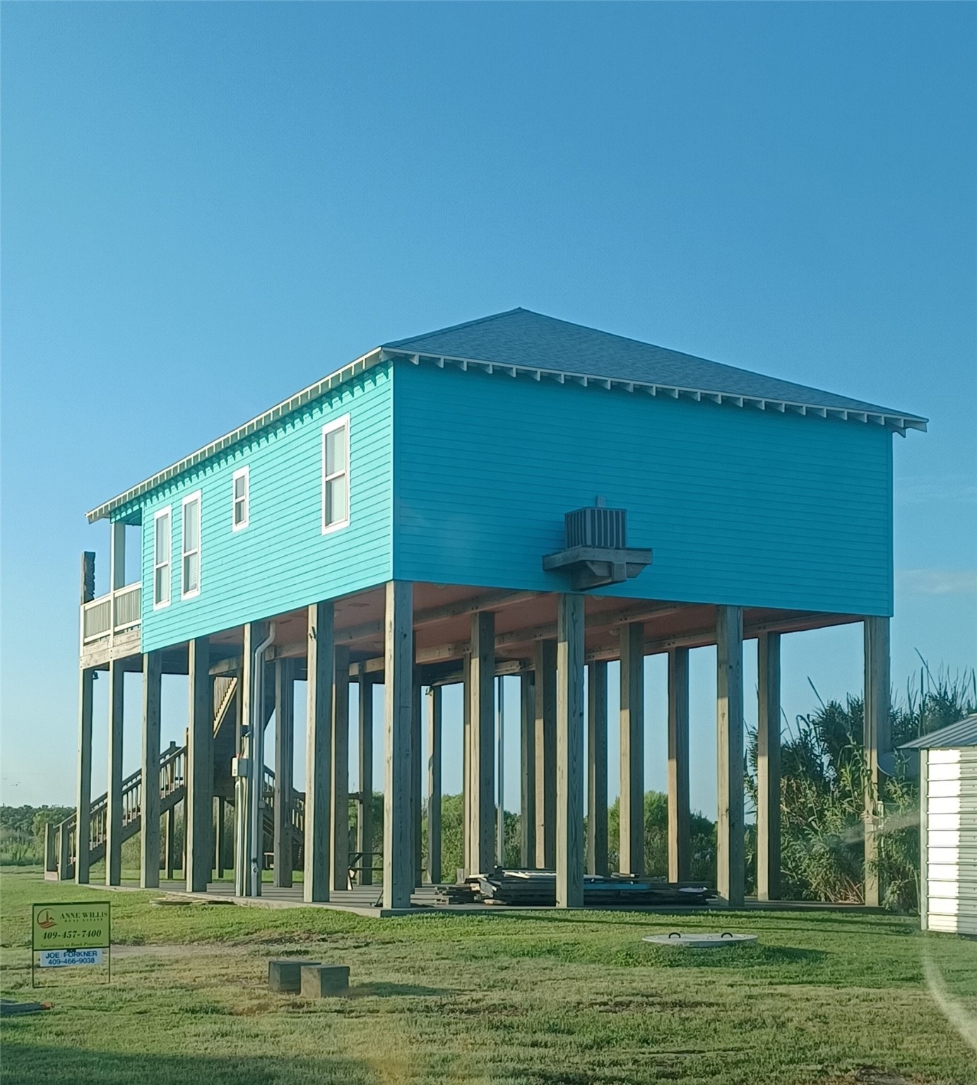 1279 Faggard Road Port Bolivar, TX 77650 - Photo 2 of 14 a front view of a house with a yard
