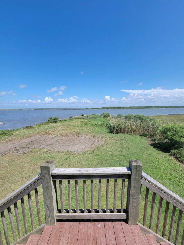 1279 Faggard Road Port Bolivar, TX 77650 - Photo 3 of 14 a view of a balcony with wooden floor and fence