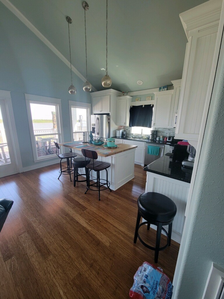 1279 Faggard Road Port Bolivar, TX 77650 - Photo 5 of 14 a kitchen with sink cabinets and dining table