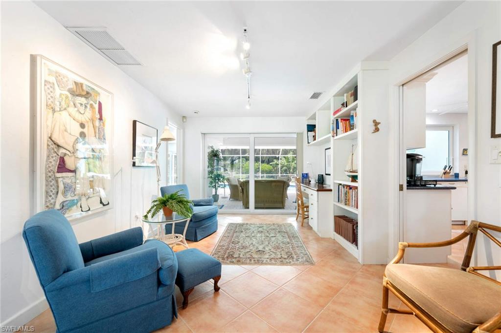 2989 Regatta Road Naples, FL 34103 - Photo 11 of 20 a living room with furniture and a large window