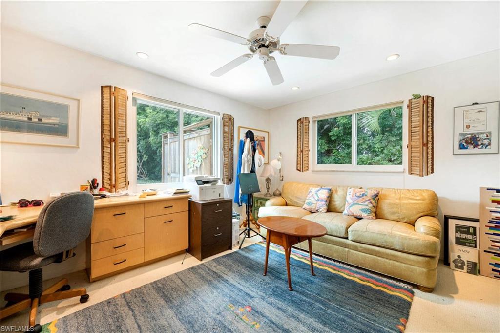 2989 Regatta Road Naples, FL 34103 - Photo 13 of 20 a living room with furniture and windows