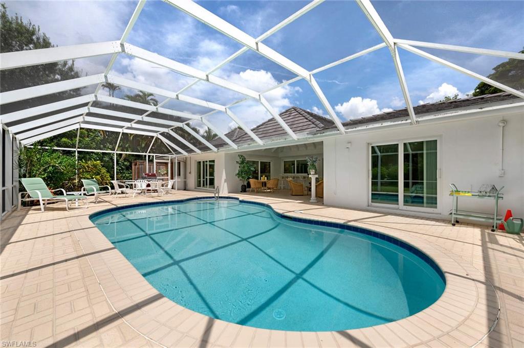 2989 Regatta Road Naples, FL 34103 - Photo 20 of 20 a view of a white building with a swimming pool