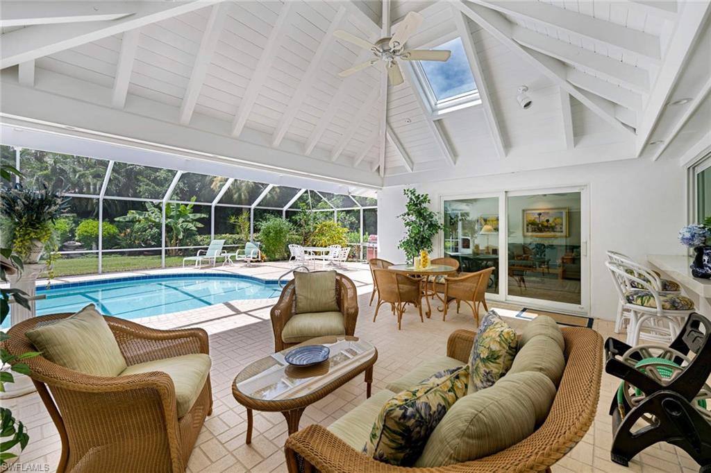 2989 Regatta Road Naples, FL 34103 - Photo 2 of 20 a living room with furniture and a large window