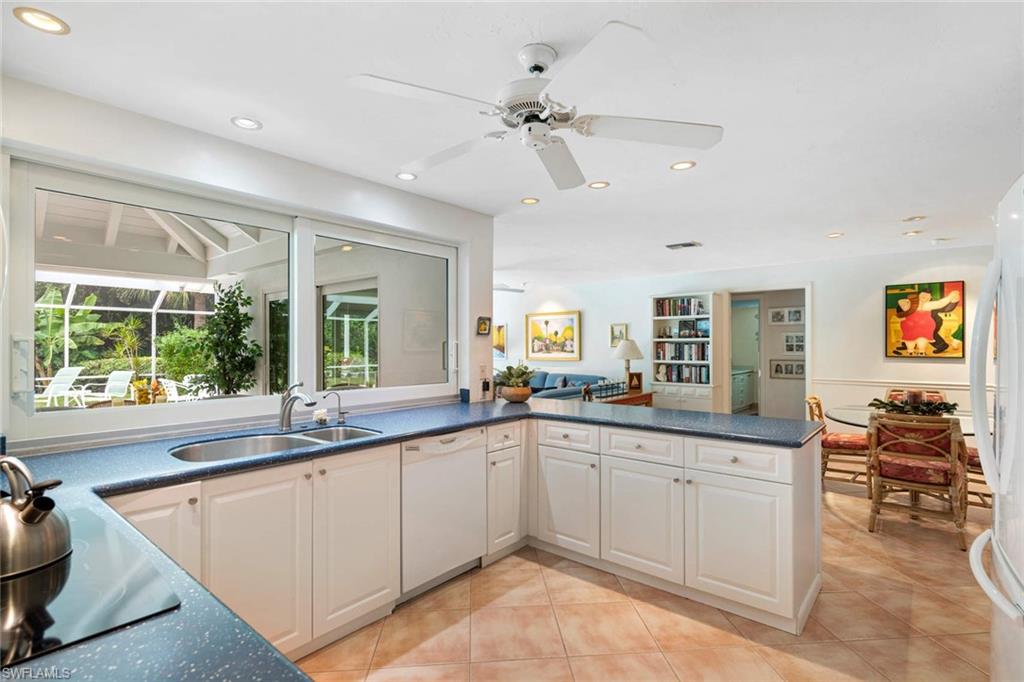 2989 Regatta Road Naples, FL 34103 - Photo 5 of 20 a large white kitchen with a large window