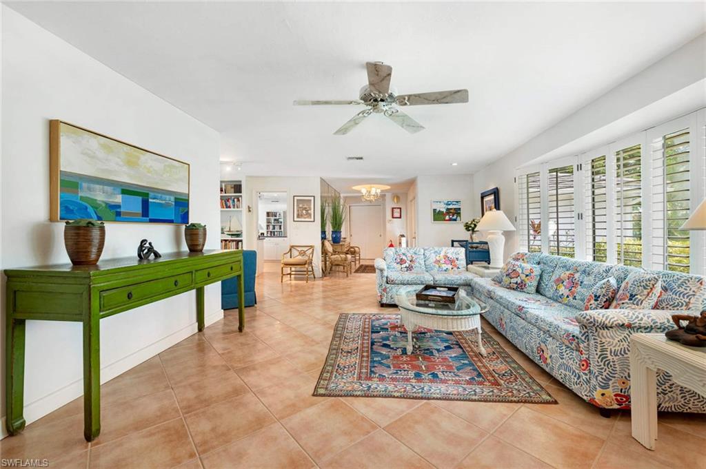 2989 Regatta Road Naples, FL 34103 - Photo 9 of 20 a living room with furniture and a large window