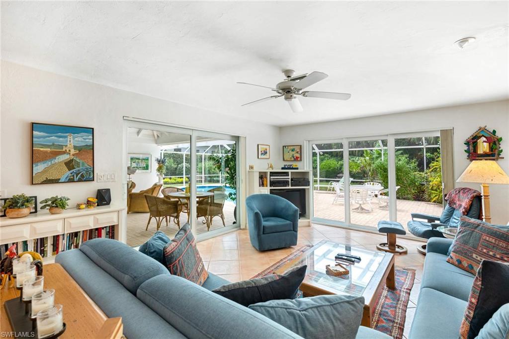 2989 Regatta Road Naples, FL 34103 - Photo 10 of 20 a living room with furniture and a large window