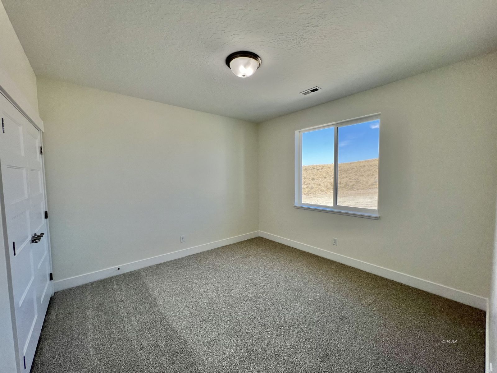 142 Diamond Rdg Drive Spring Creek, NV 89815 - Photo 13 of 36 an empty room with a empty space and windows