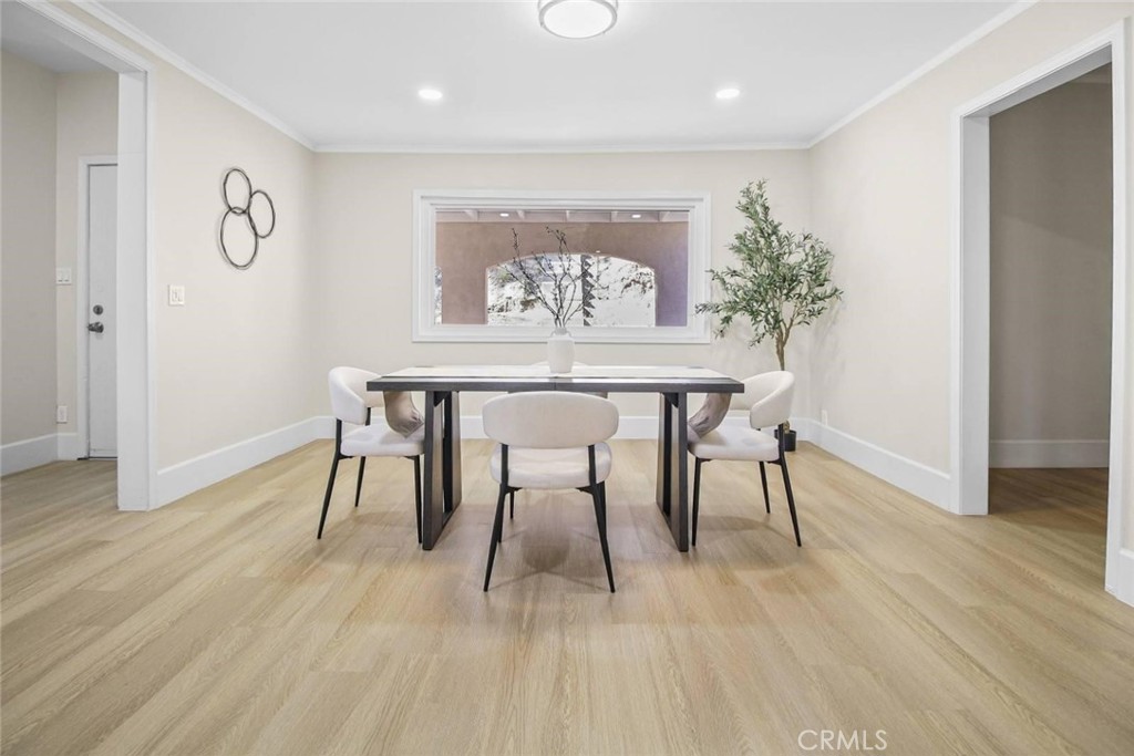 986 West Marshall Boulevard San Bernardino, CA 92405 - Photo 7 of 31 a view of a dining room with furniture and wooden floor