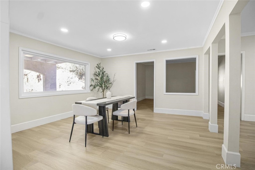 986 West Marshall Boulevard San Bernardino, CA 92405 - Photo 9 of 31 a view of a dining room with furniture window and wooden floor