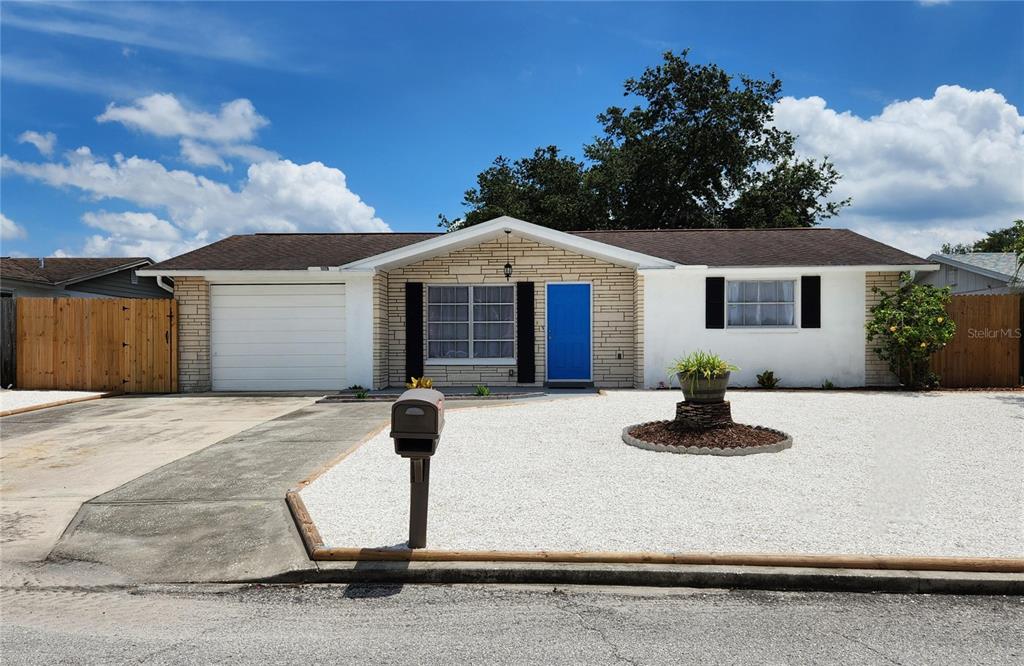 11120 White Oak Lane Port Richey, FL 34668 - Photo 1 of 1 a front view of a house with yard
