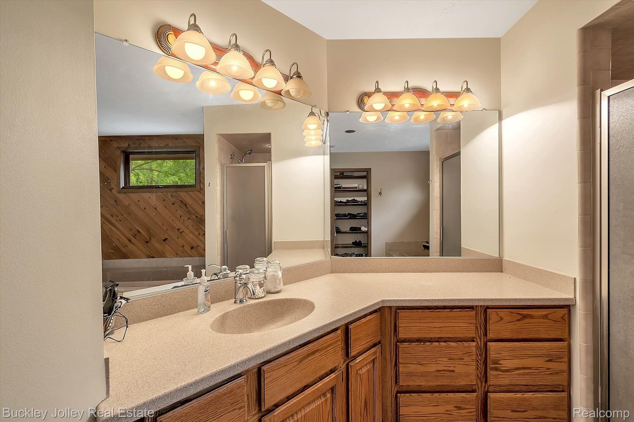 7926 Winans Lake Road Brighton, MI 48116 - Photo 9 of 36 Generous Corian Counter in the Ensuite.jpg