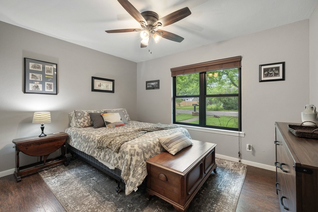 302 South Schramm Road Granger, TX 76530 - Photo 19 of 33 a bedroom with a bed and a window