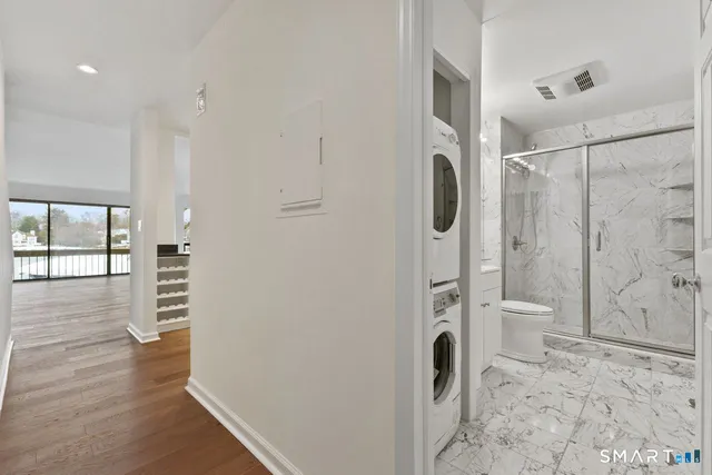 a bathroom with a toilet and a shower