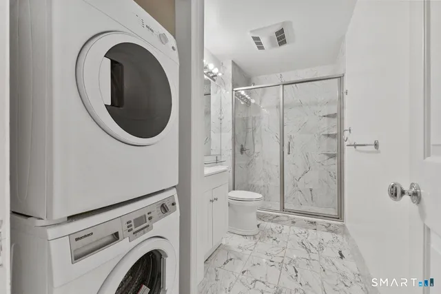 a bathroom with a toilet and a sink