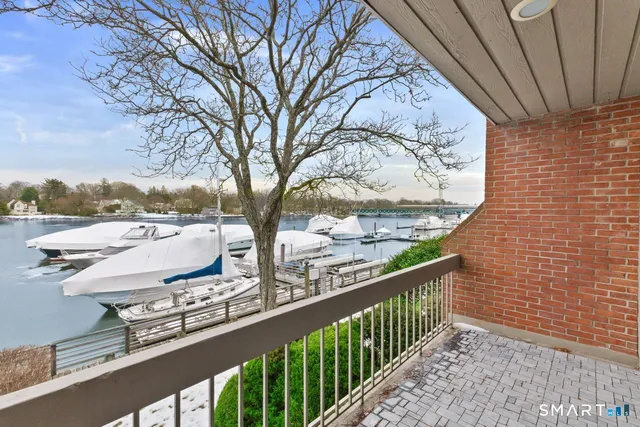 a view of balcony with wooden floor