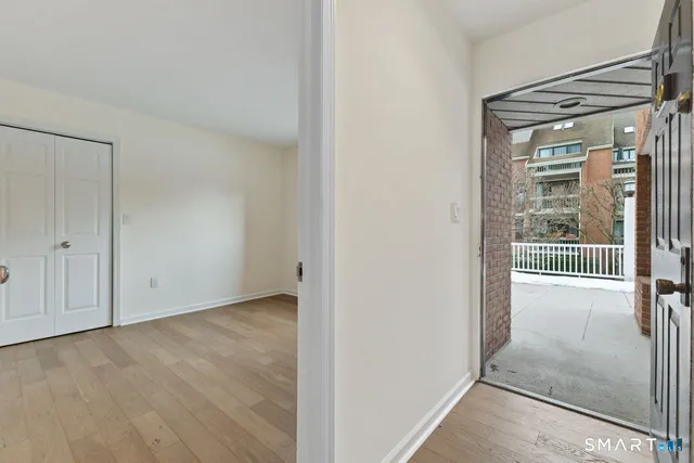 a view of entryway with wooden floor