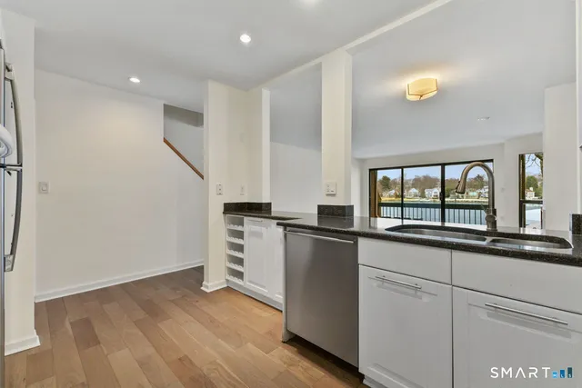 a kitchen with sink and cabinets