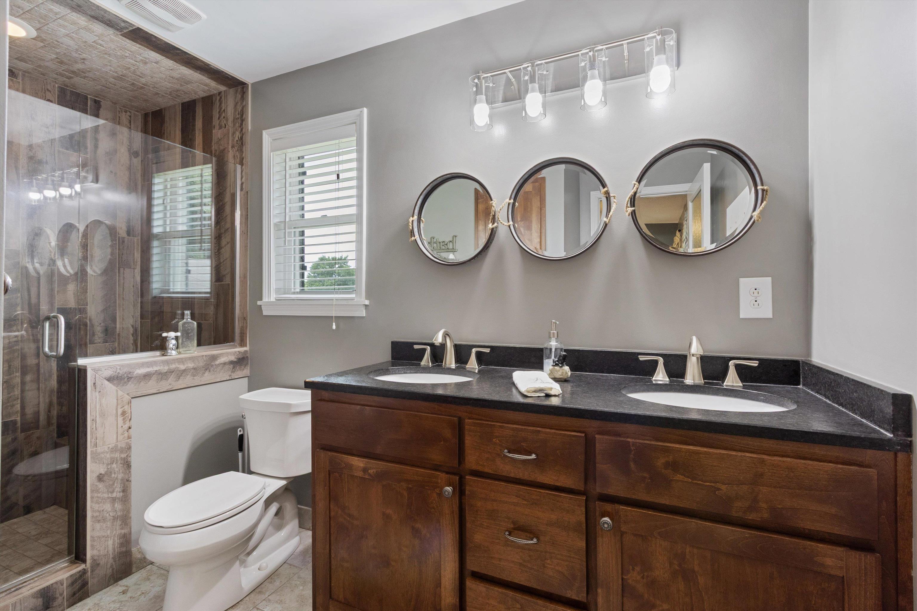 4500 Drummonds Road Drummonds, TN 38023 - Photo 16 of 29 a bathroom with a granite countertop a mirror and a toilet
