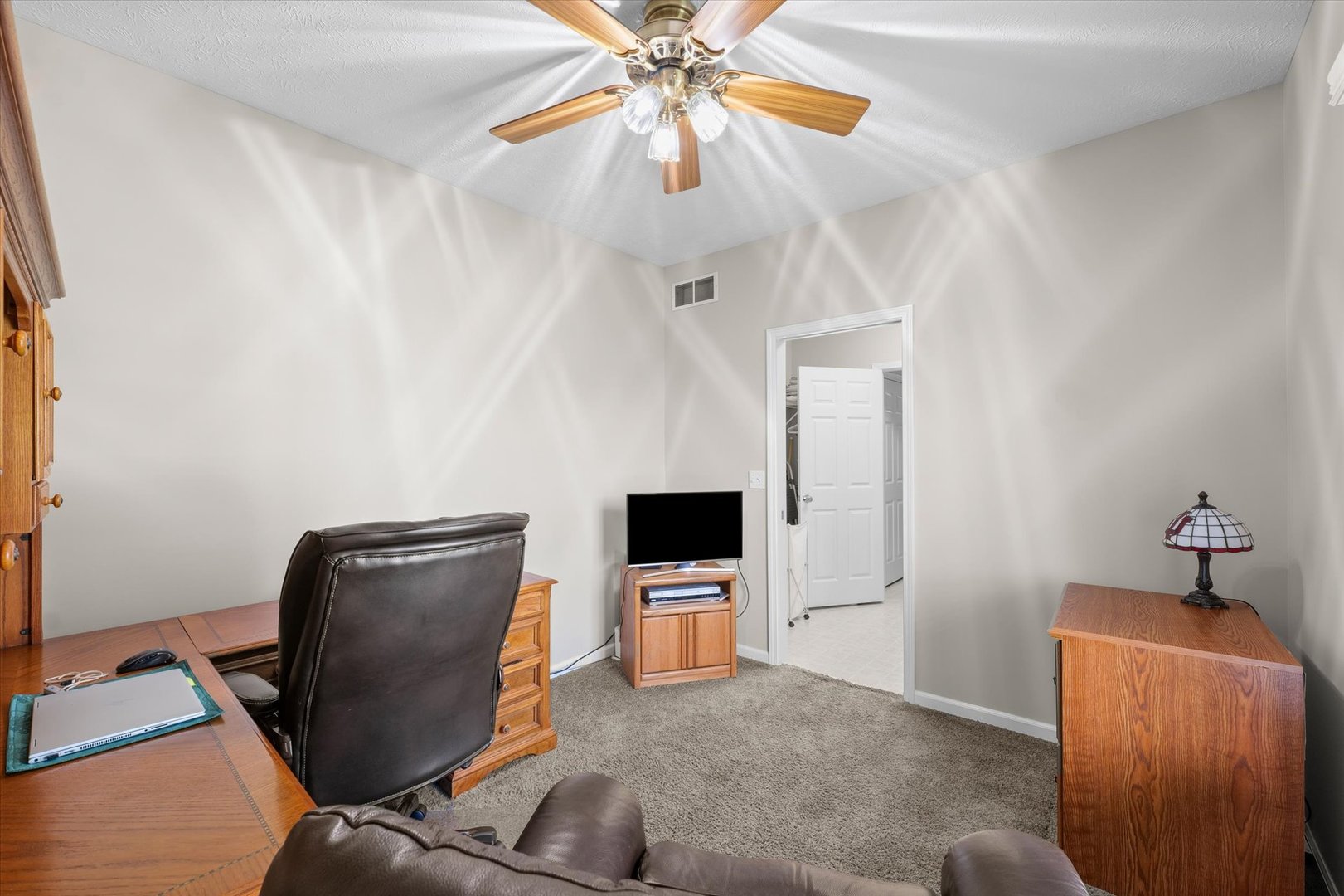 3908 Turnberry Drive Champaign, IL 61822 - Photo 22 of 49 a living room with furniture and a flat screen tv